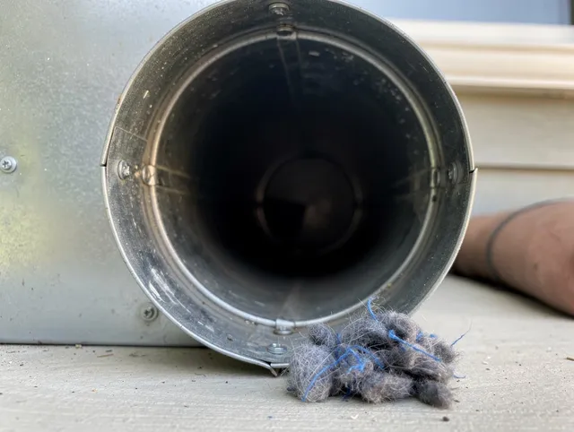West Hollywood Dryer Vent Cleaning technician using specialized equipment to clear severe dryer vent blockage in West Hollywood